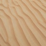 A serene view of golden sand dunes with smooth textures in Dubai's desert, perfect for backgrounds and wallpapers.